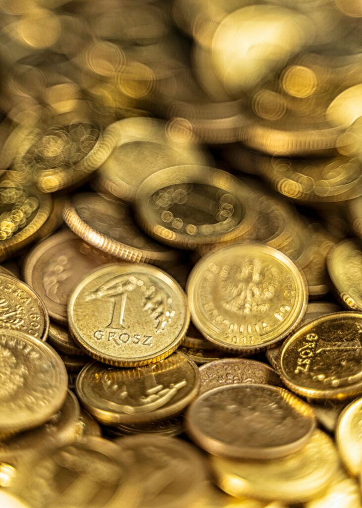 pexels photo 10379149 10379149 Detailed close-up of Polish grosz coins shining with a golden hue symbolizing wealth and finance.